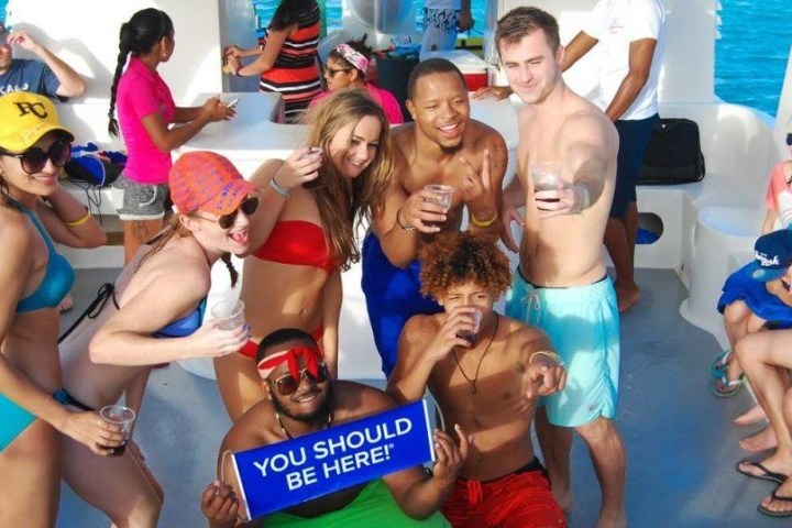 group posing for a picture on boat